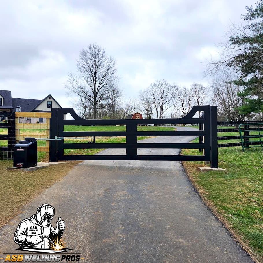 Black horizontal ranch-style driveway gate with welded steel frame.