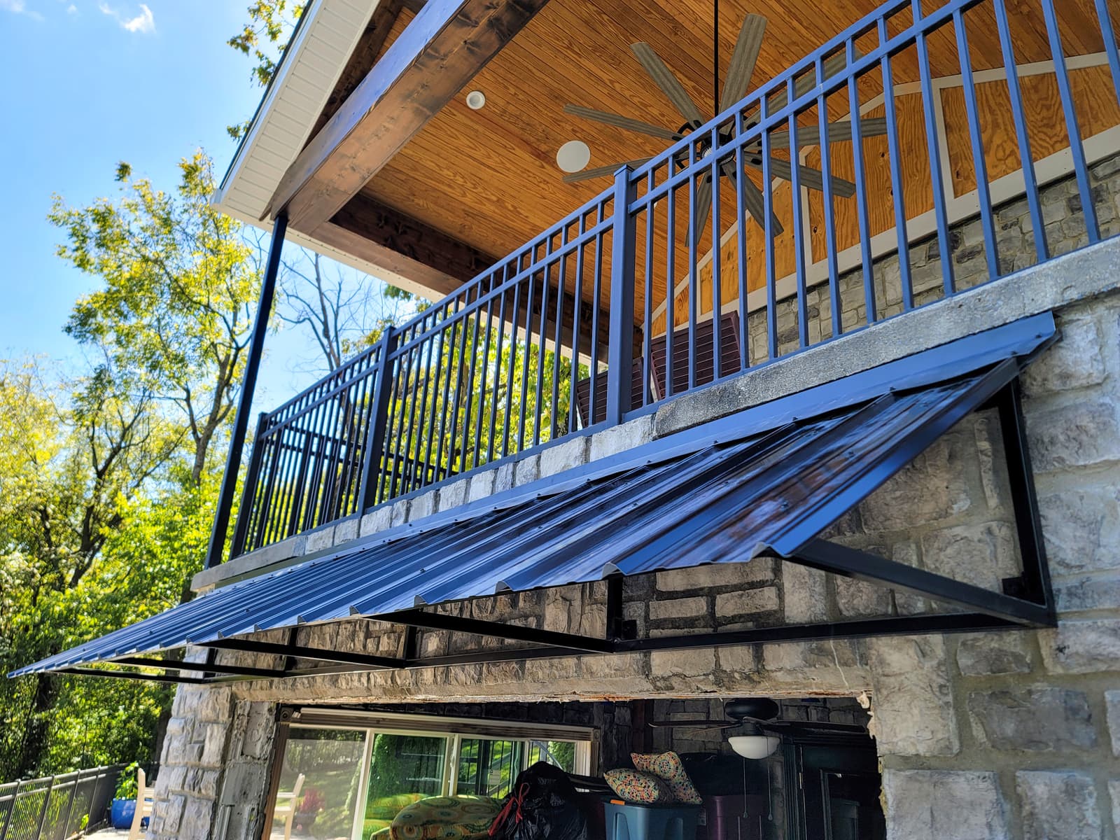 Custom metal awning frame with welded perimeter and support members.