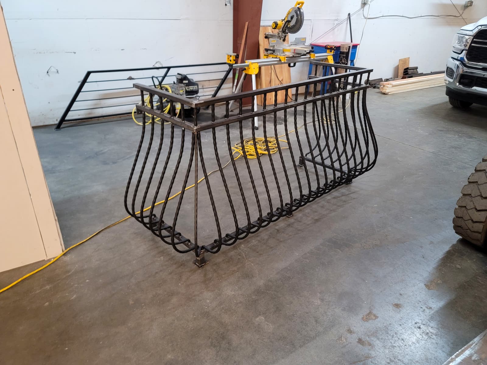 Ornamental iron-style metal detail prepared for repair or finish work.