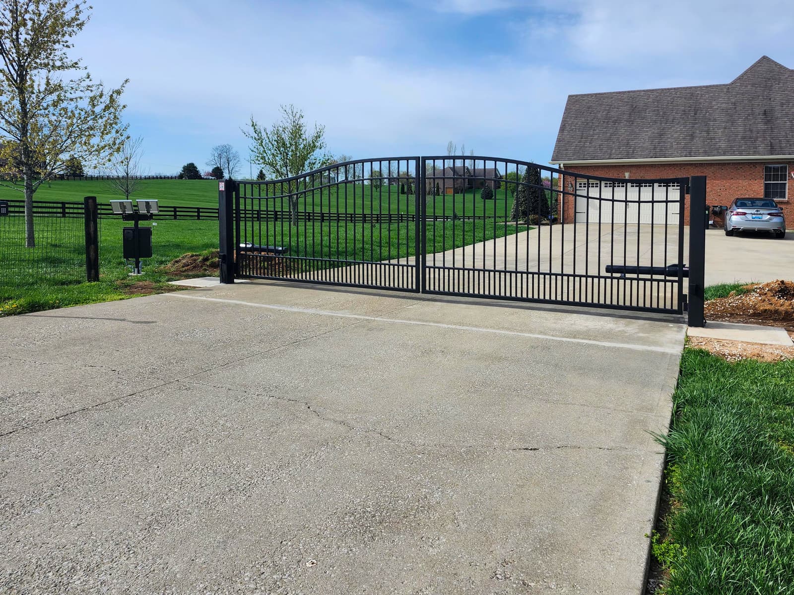 Large metal swing gate staged for Central Kentucky installation.