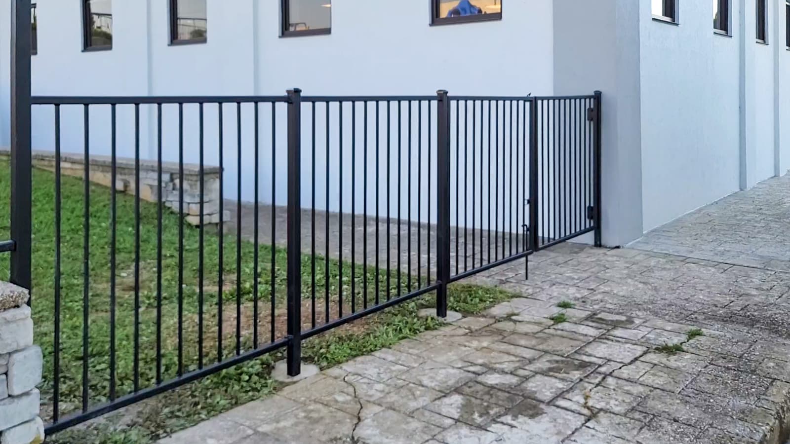 Metal railing and guardrail installed along a church walkway.