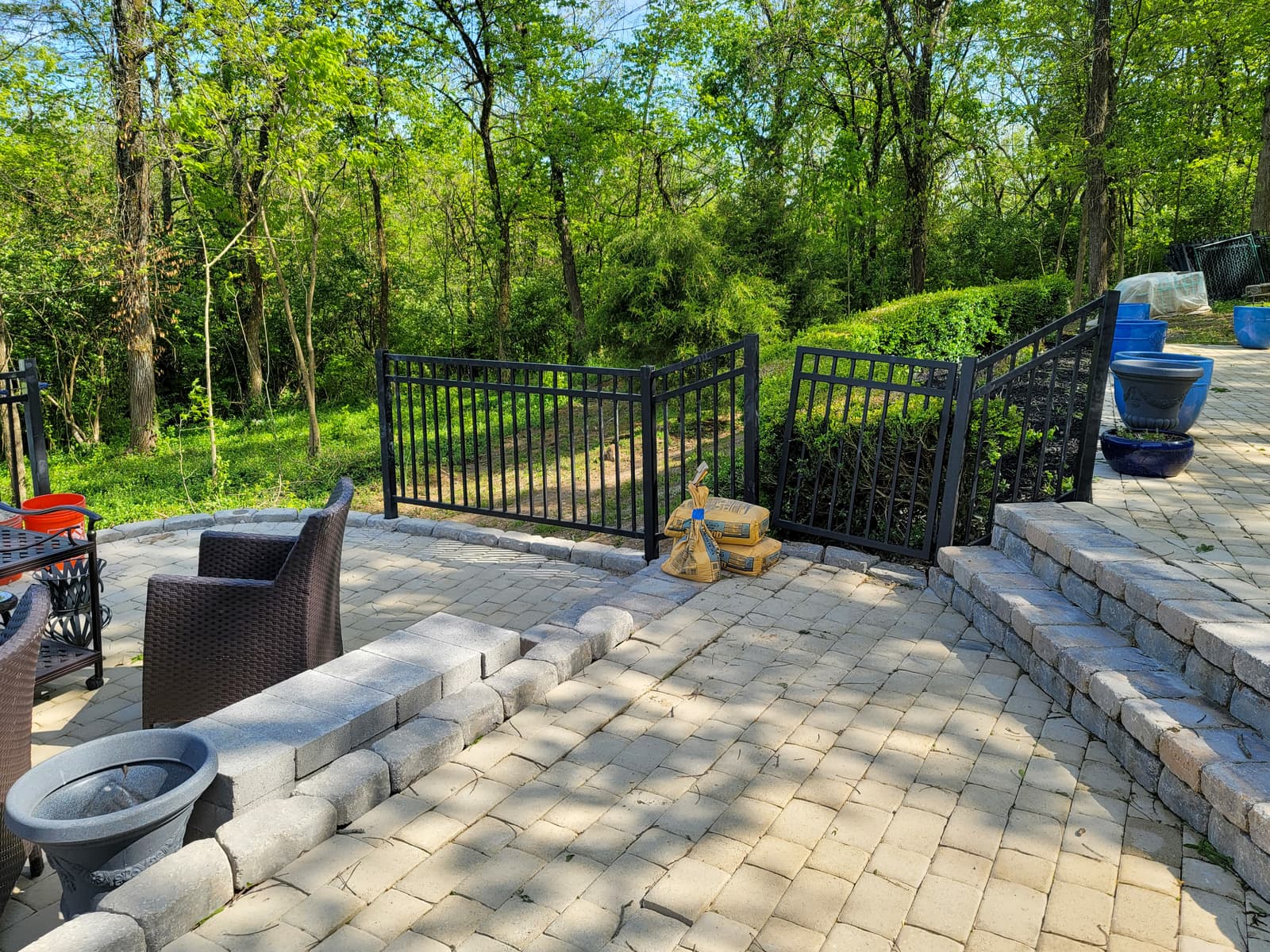 Outdoor metal deck railing with welded pickets and posts.