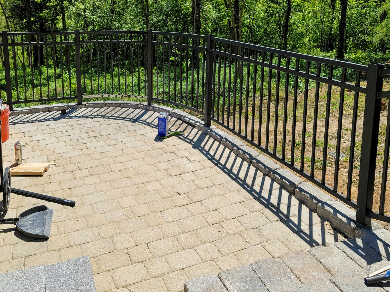 Custom metal deck railing with welded posts and picket sections.