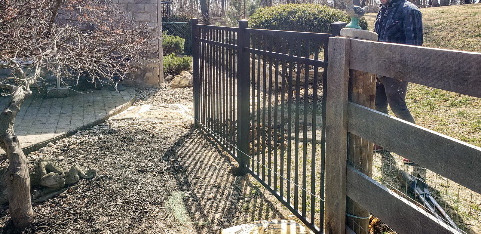 Metal deck railing installed beside an outdoor seating area.