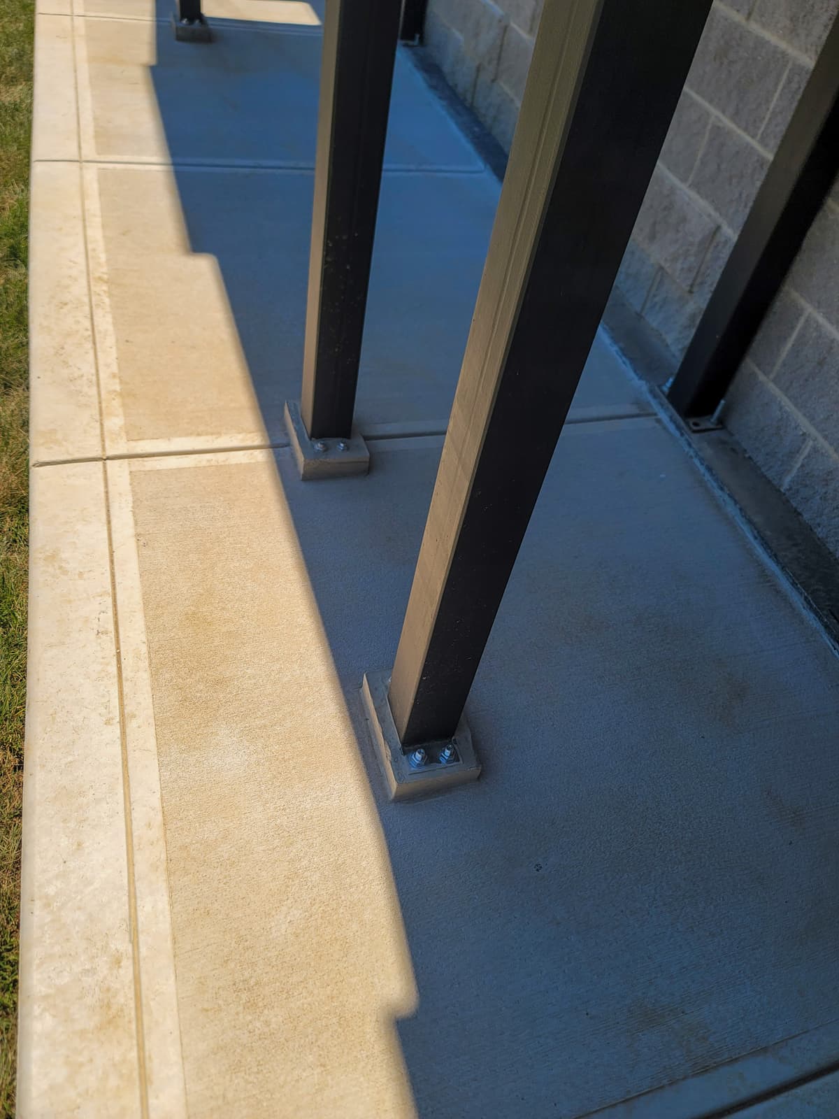 Welded metal stair run and support work for an exterior fire escape.