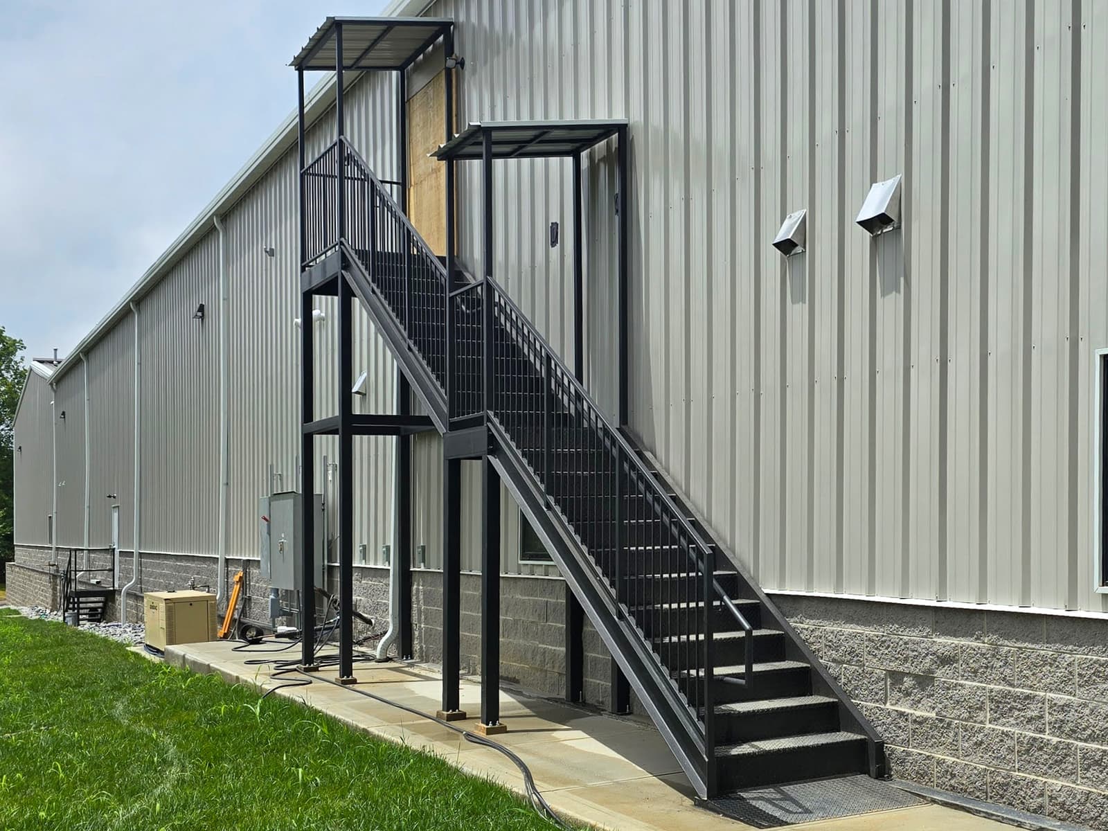 Commercial fire escape landing, guardrail, and stair fabrication details.
