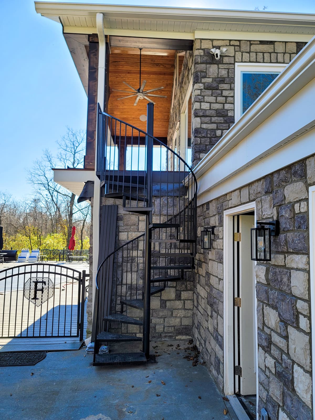 Spiral metal staircase center-column and tread fabrication detail.