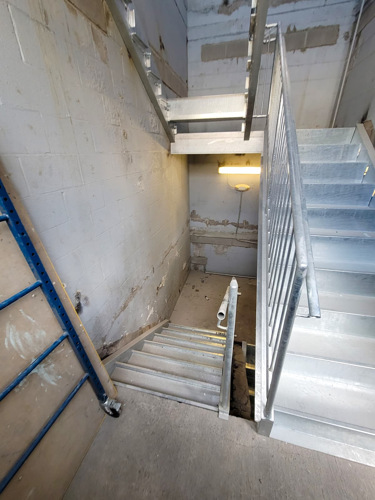 Commercial metal staircase rebuild and welded structural repairs.